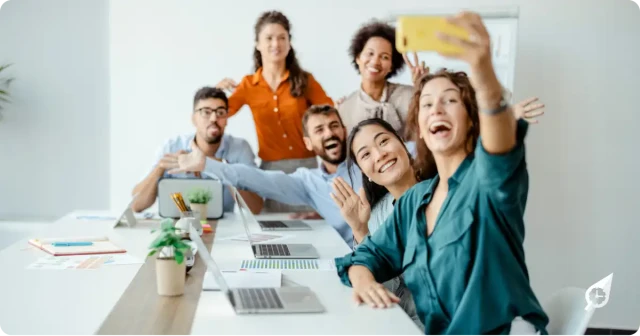 Employees taking a selfie together